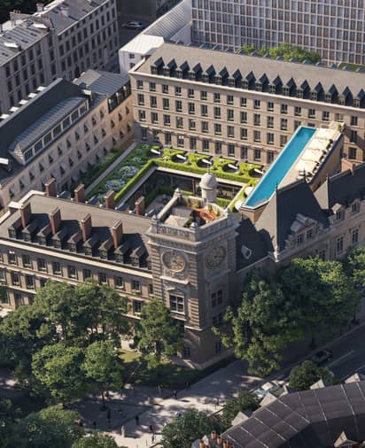 Aerial view of The Maybourne Saint-Germain, a luxury hotel in Paris, featuring a rooftop pool, lush gardens, and historic architecture.