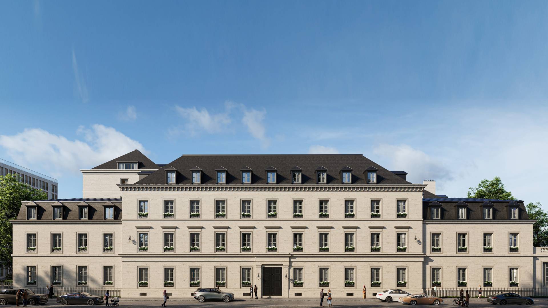Elegant hotel facade with symmetrical windows and black mansard roof, under a clear blue sky with light pedestrian activity.