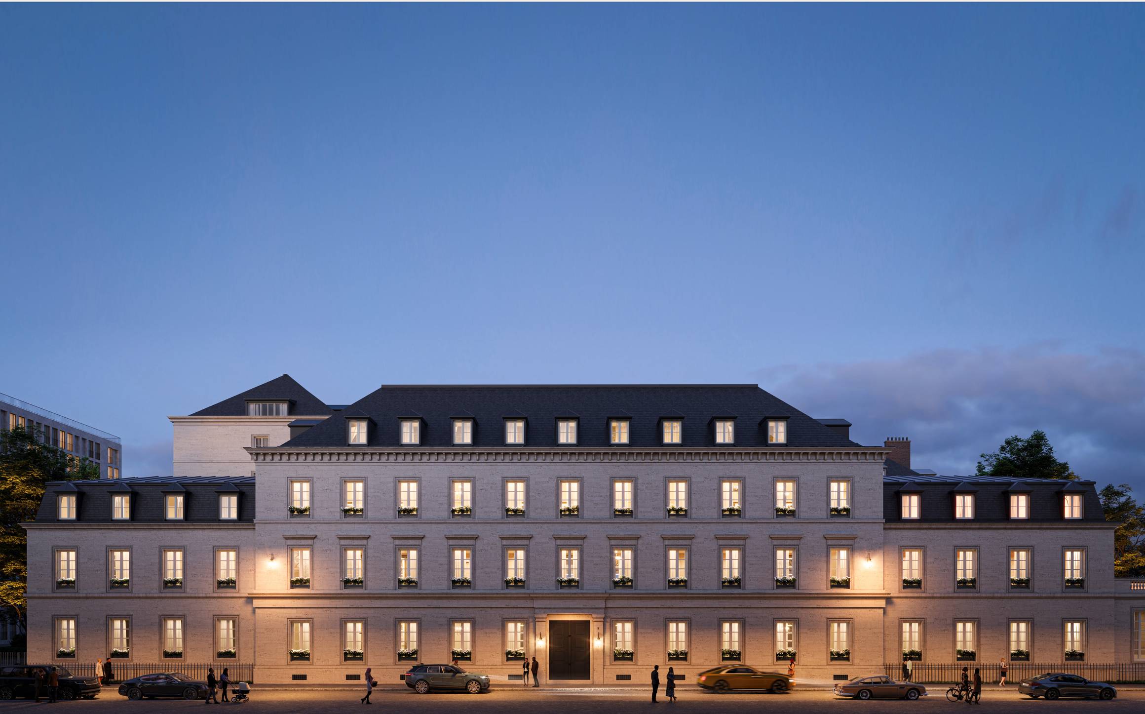 A stately neoclassical building at dusk, illuminated by warm lighting, exuding timeless sophistication with symmetrical windows and a grand entrance.