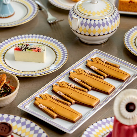 Cakes in the shape of design coats and The Berkeley branded china.