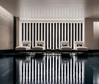 The Aman Spa at The Connaught in London - Four loungers next to the spa pool